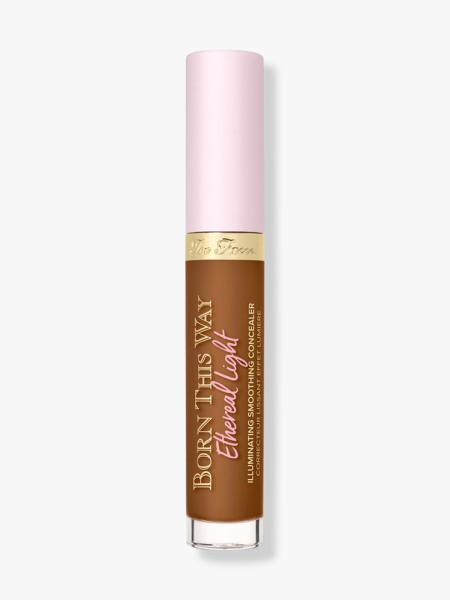 Too Faced Born This Way Ethereal Light Illuminating Smoothing Concealer vial of concealer with a light pink cap on light gray background