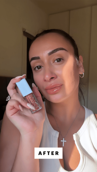 Trakoshis after applying Kosas Wet Lip Oil in Bare on her lips